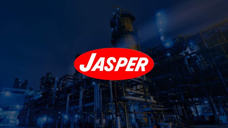 The Jasper logo, overlayed on an image of an oil refinery at night.